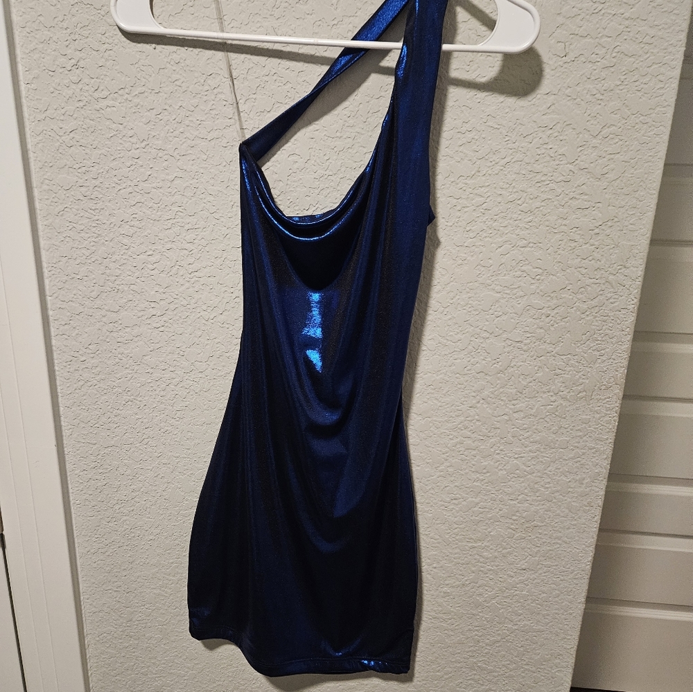 A short slim fit royal blue dress with an open back and one sholder strap